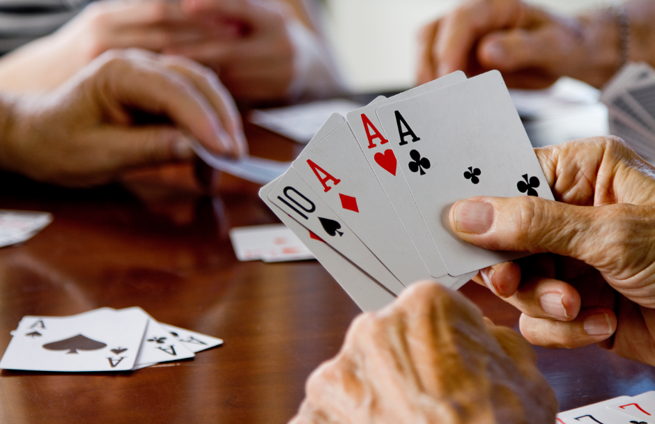 An up close image of people holding cards.